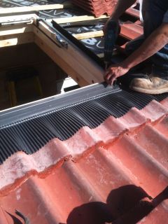 how to install tiles under a velux
