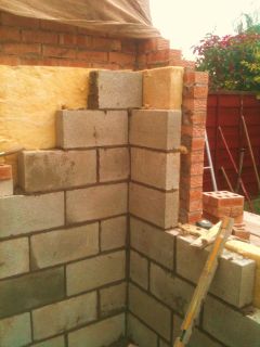 Cavity wall insulation in an extension